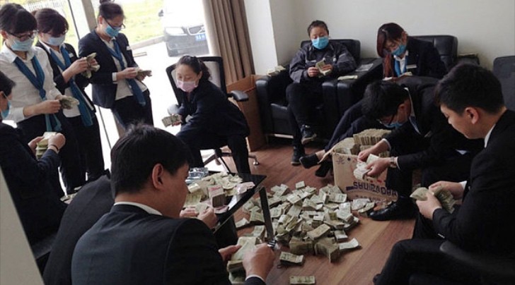 Chinese employees counting money