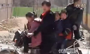 Chinese Woman Rides Bike with 5 Kids