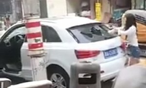 Woman Methodically Smashes Audi Q3 with a Rock in China