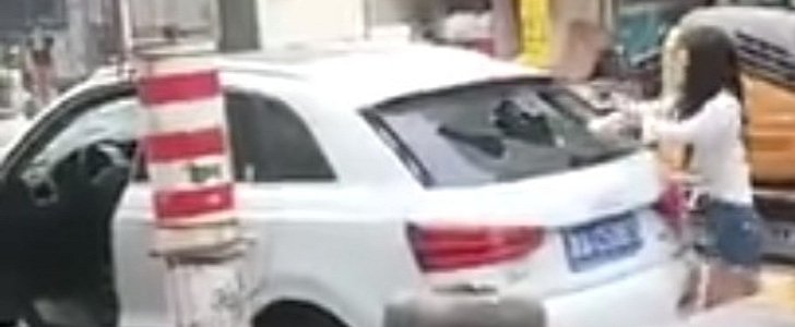 Woman Methodically Smashes Audi Q3 with a Rock