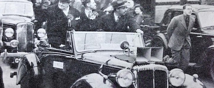 Winston Churchill riding in the Daimler DB18 Drophead Coupe