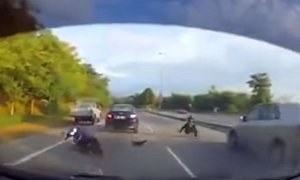Close Call: Biker Crashes, Is Thrown in Front of Speeding Car, Walks it Off