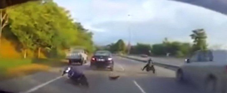 Biker rear-ends one car, is thrown in front of another but narrowly avoids being hit