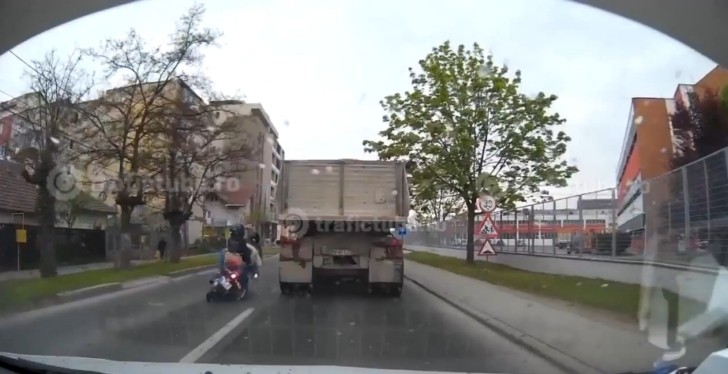 Clumsy Rider and His Passenger Almost Squashed by Truck