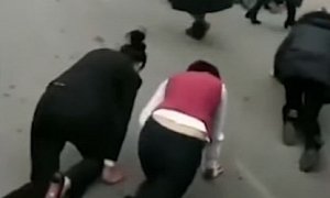 Company Forces Underperforming Staff to Crawl on All Fours Through Traffic
