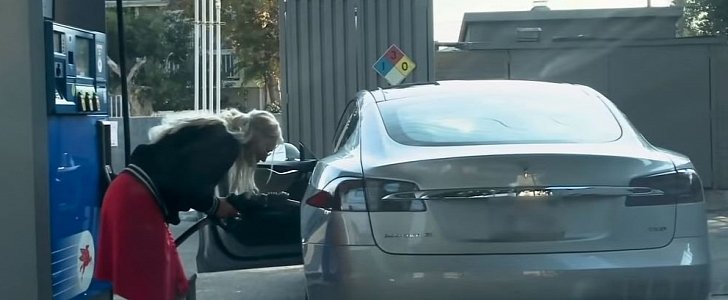 Blonde tries to fill up her Tesla Model S with gas