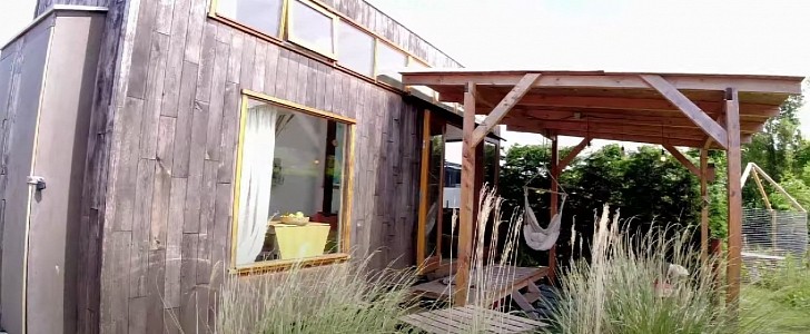 Tiny home features a spacious covered porch
