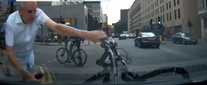 Cyclist uses his bike to hit the car of a female driver in London