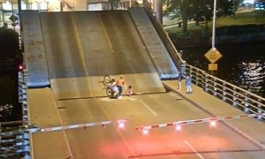 Cyclist Ignores Lift Bridge Warnings, Falls into the Gap