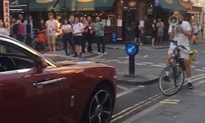 Cyclist With Megaphone Rants at Rolls-Royce Owner for Parking on Double Lines