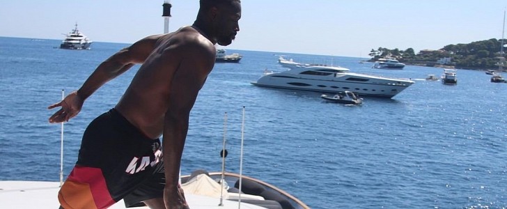 D-Wade shows off his skills, by jumping in the water from a high-end yacht, during his vacation