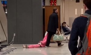 Dad Drags Daughter by The Hood Through Airport, Controversy Ensues