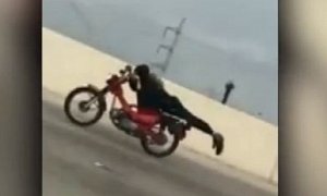 Daredevil Biker Does The Superman on Busy Texas Highway