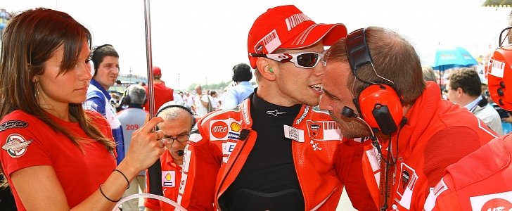 Stoner in his Ducati days, with his current wife Adrianna and Livio Suppo