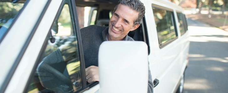 Man Happily Driving His Van