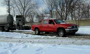Dodge Dakota Pickup Pulls Semi Truck Stuck in Snow