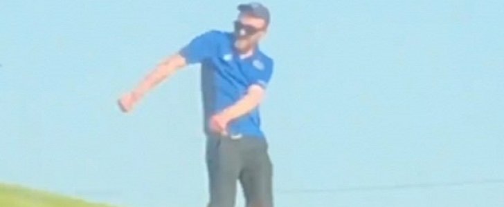 Domino's employee entertains drivers on the side of Scotland road