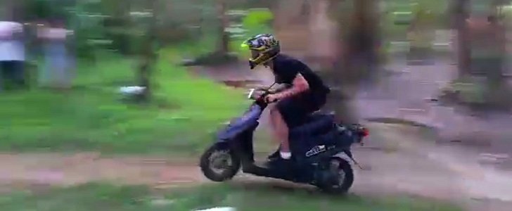 Jackson "Jacko" Strong jumps a scooter over a creek