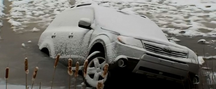 2010 Subaru Forester goes under as ice breaks during attempt to cross the lake