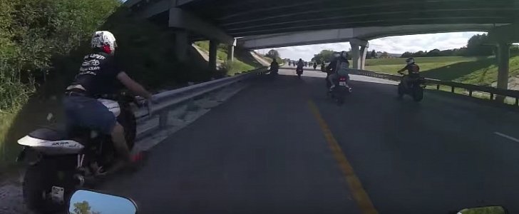 Rider hits guardrail