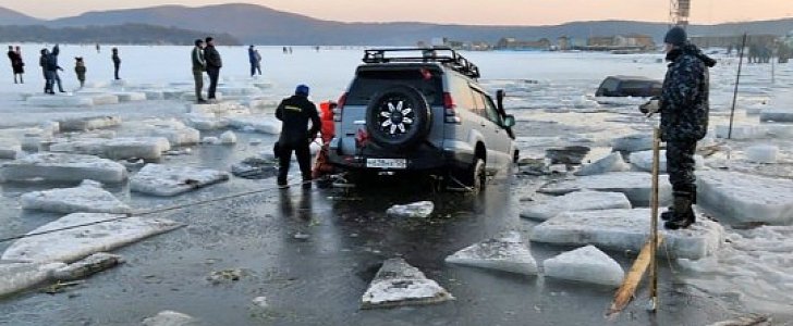 At least 45 cars sunk into frozen waters after fishermen parked on ice in Russia