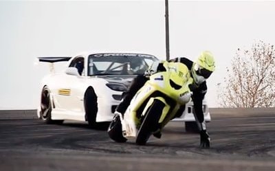 Insane motorcycle vs. car drift battle