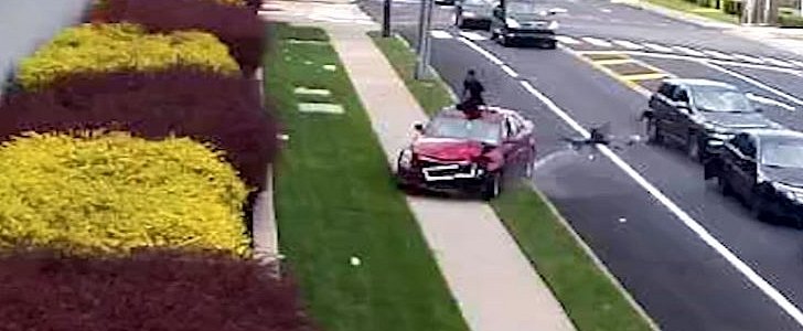 Driver climbs out of moving Caddilac, to flee accident he caused at Philadelphia intersection