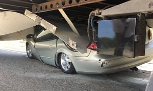Driver Hits Obstacle, Goes Airborne and Slips Under Tractor Trailer, Survives