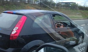 Driver Plays iPad Racing Game While Sweeping with 65 Mph on the Motorway