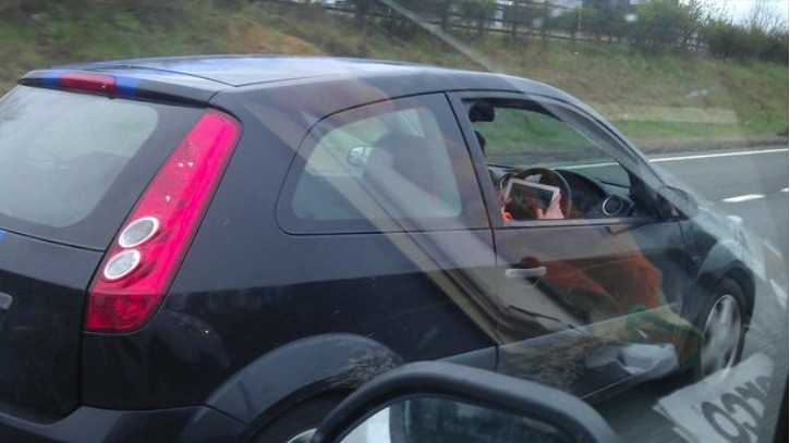 Driver Plays iPad Racing Game While Sweeping with 65 mph