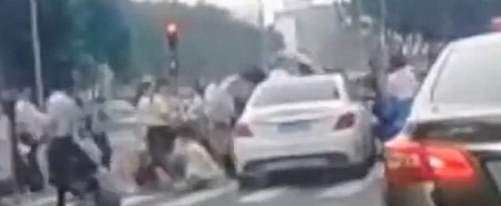 Mercedes plows through pedestrians at crossing in China