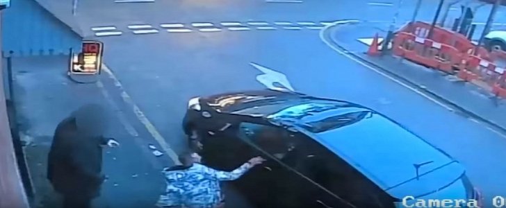 Drug addict jumps out of hotel window, lands on parked car, then tries to steal it
