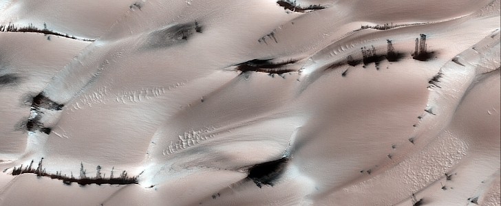 Dark sand visible over the dry ice on Mars