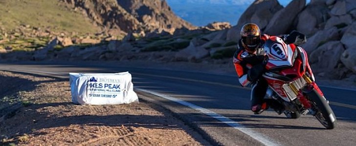 Carlin Dunne climbs to the top of Pikes Peak