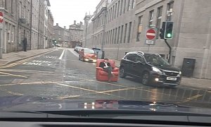 Guy Rolls Leather Armchair in the Middle of the Street, Chills