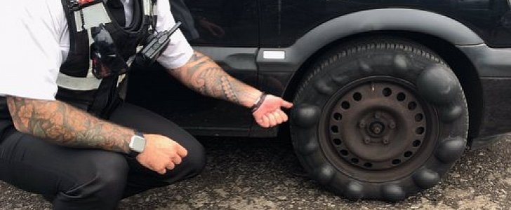 Cop pulls over car with bubbly tire, most likely saves the day