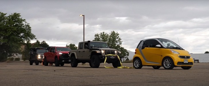 smart fortwo electric drive towing three trucks