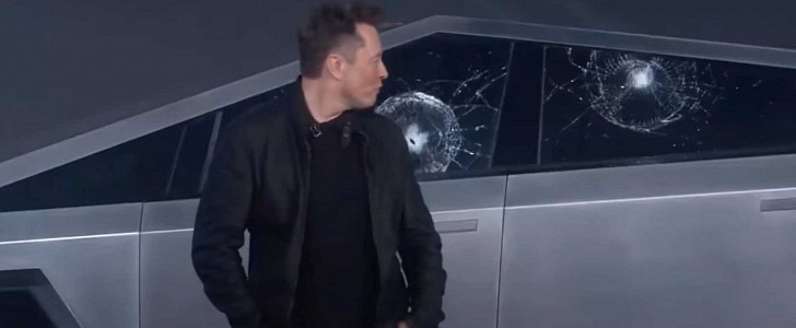 Elon Musk Sitting in Front of a Tesla Cybertruck