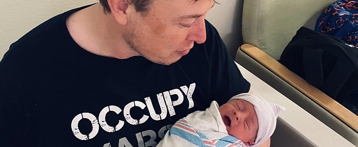 Elon Musk holds his sixth child, baby boy X Æ A-12