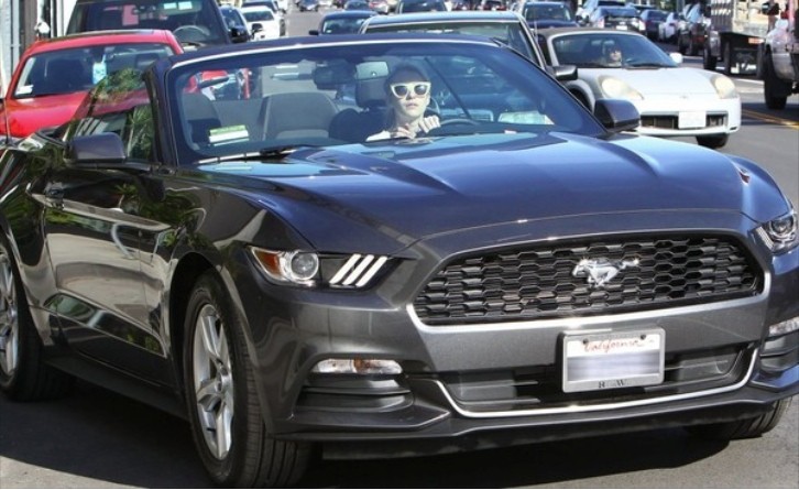 Emma Roberts driving her 2015 Ford Mustang convertible