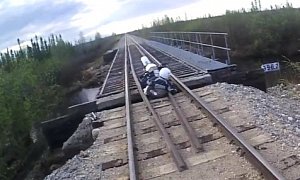 Enduro Bike Falls Through Railroad On a Bridge