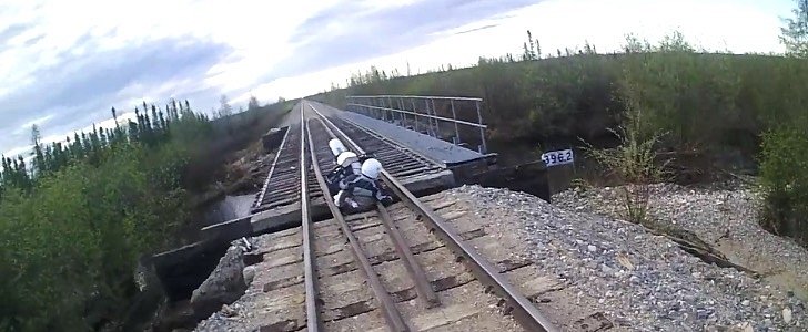 Bike falls through railroad
