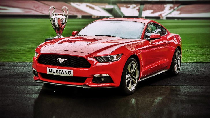 2015 Ford Mustang along with the UEFA Champions League trophy