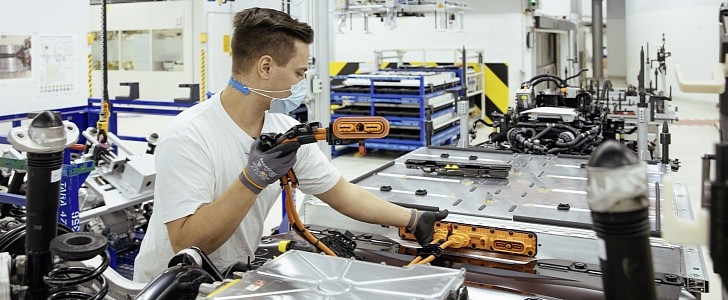 Workers producing electric cars at Volkswagen