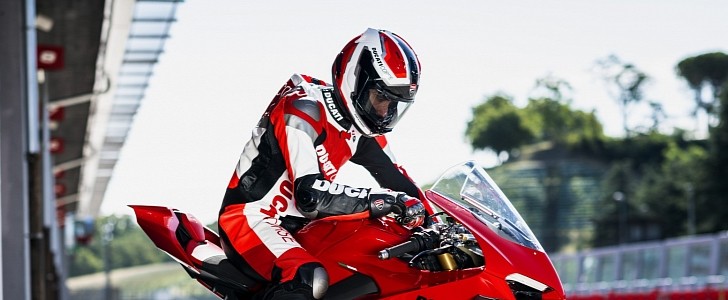 Rider wearing a Ducati Corse Power helmet - for illustration purposes