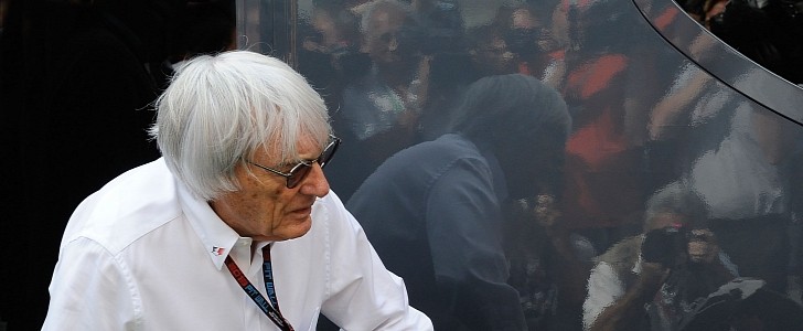 Bernie Ecclestone observing a Brembo-branded trophy during an F1 event