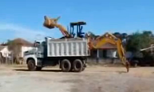 Excavator Load into Dump Truck Is Hydraulic Ballet