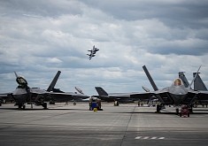 F-15 Eagle Buzzes Parked Raptors, Because What Can Be Cooler
