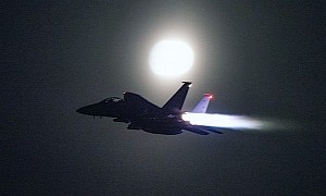 F-15E Strike Eagle Flying With Afterburners Outshines the Moon