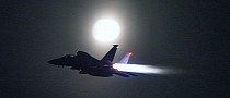 F-15E Strike Eagle Flying With Afterburners Outshines the Moon